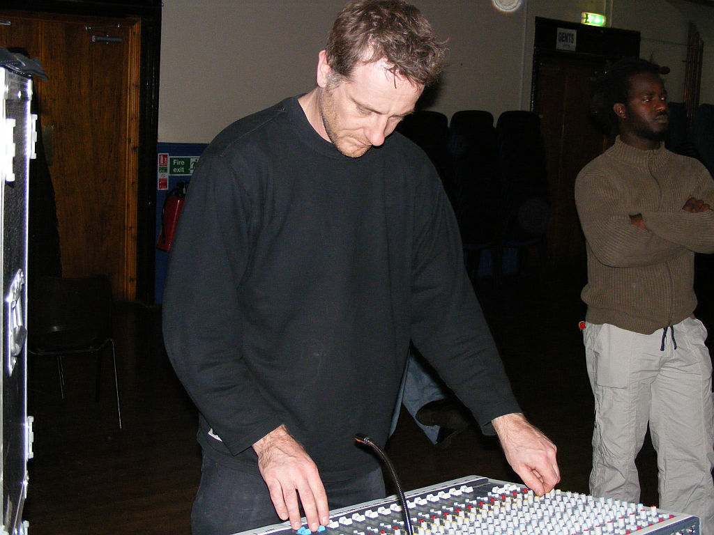 Mark Burton, sound-checking Baka Beyond at Lydney Tpwn Hall, 2007