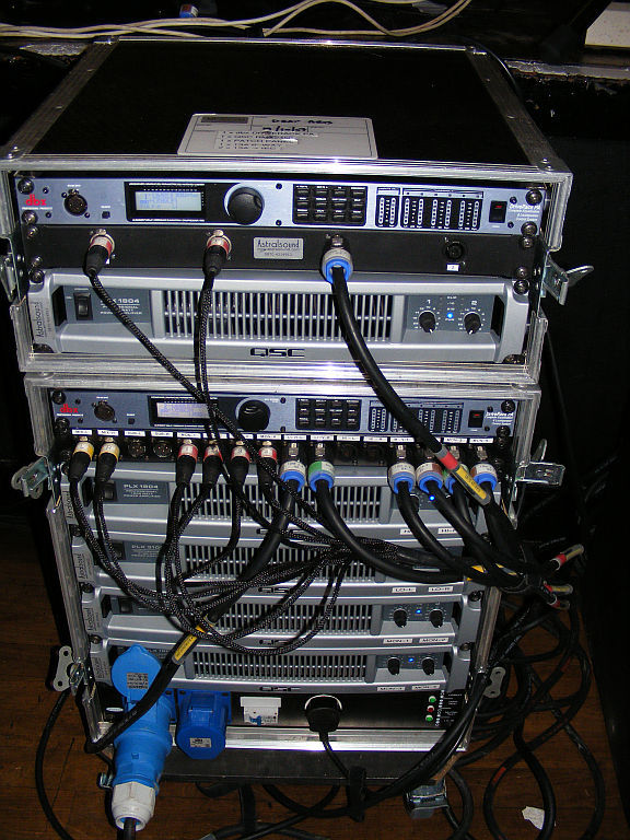 Five QSC PLX2 amplifiers in use
